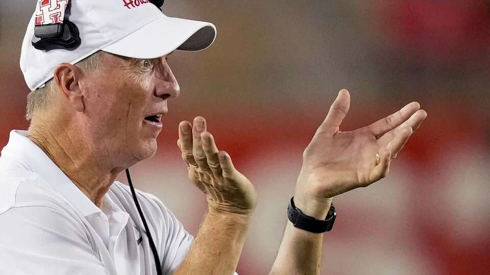 Houston head coach Willie Fritz claps on the sidelines during the second half of an NCAA college football game Saturday, Aug. 31, 2024, in Houston.