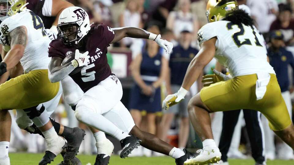 Texas A&M Aggies running back Amari Daniels (5) runs the ball during the fourth quarter of a non-conference college football game at Kyle Field, Saturday, Aug. 31, 2024, in College Station.