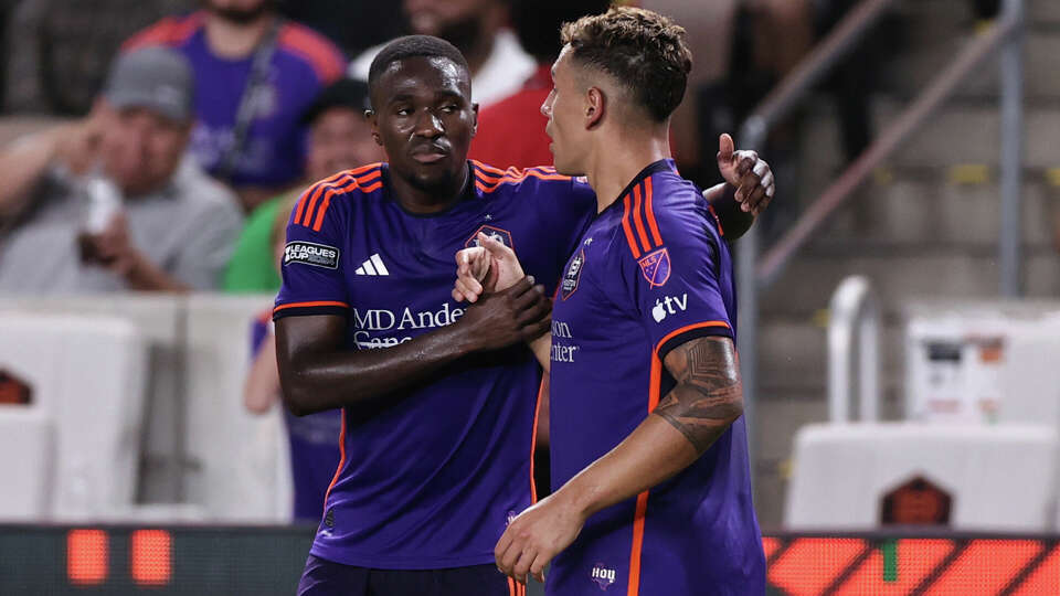 Ezequiel Ponce #10 of Houston Dynamo FC celebrates with his teammate Aliyu Igrahim #18 after scoring first goal at the Toluca FC v Houston Dynamo: Round of 32 - Leagues Cup 2024 game at Shell Energy Stadium on August 9, 2024 in Houston, Texas. (Photo by Omar Vega/Getty Images)