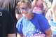 State Rep. Katie Stuart walks along the route of the Granite City Labor Day Parade on Sept. 2, 2024. Stuart served as the parade's grand marshal.