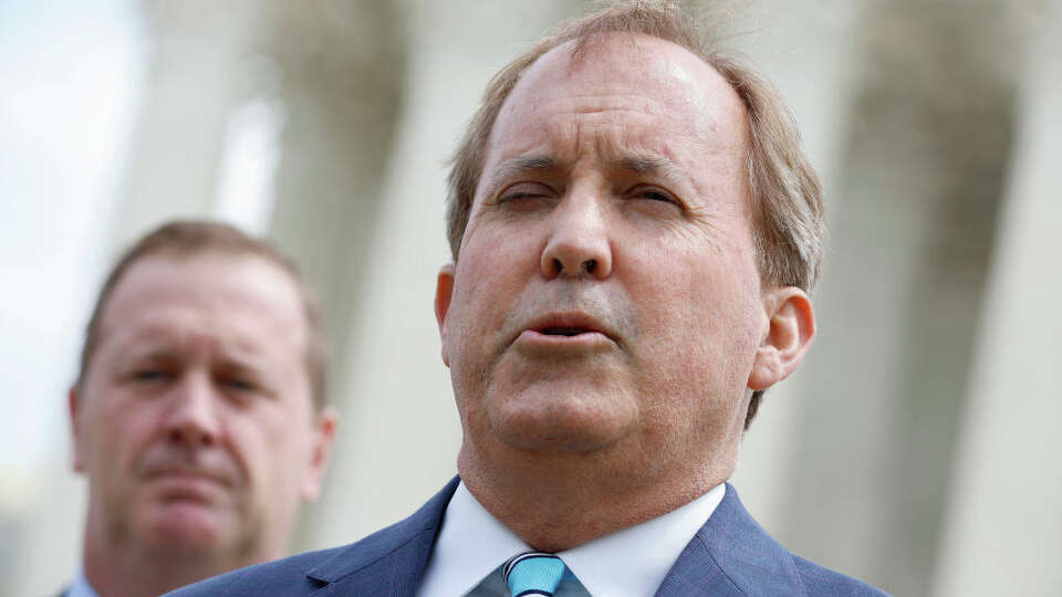 Texas Attorney General Ken Paxton and Missouri Attorney General Eric Schmitt talk to reporters after the U.S. Supreme Court heard arguments in their case about Title 42 on April 26, 2022 in Washington, DC. (Photo by Chip Somodevilla/Getty Images)