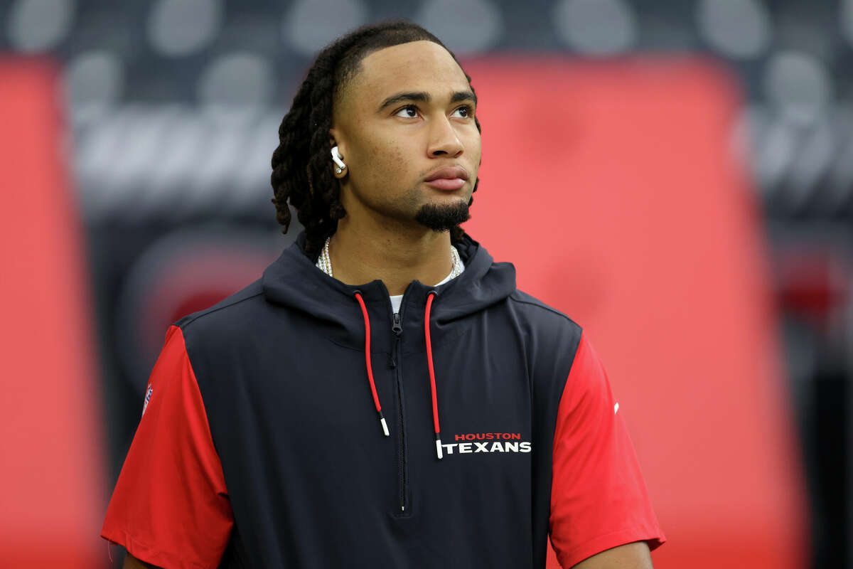 HOUSTON, TEXAS - AUGUST 24: C.J. Stroud #7 of the Houston Texans walks on the field before the preseason game \al at NRG Stadium on August 24, 2024 in Houston, Texas. (Photo by Tim Warner/Getty Images)