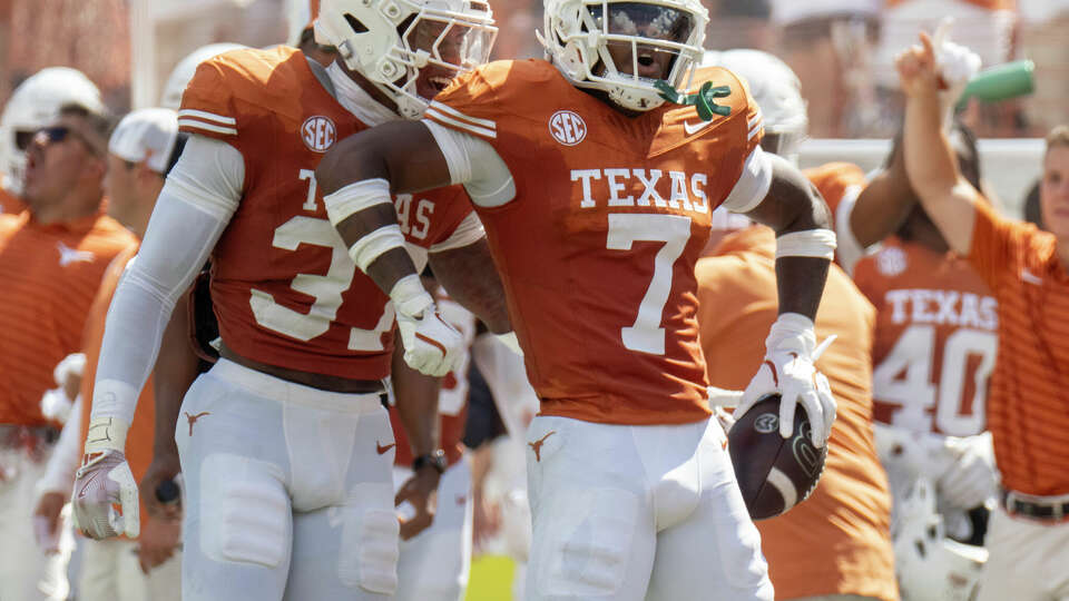 Texas defensive back Jahdae Barron, celebrating an interception against Colorado State, later took a stab at the Longhorns' new 'Texacalibur' sword for turnovers. 