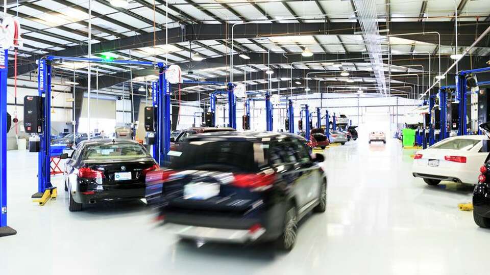 Autos are prepared for sale at a Carvana location. 