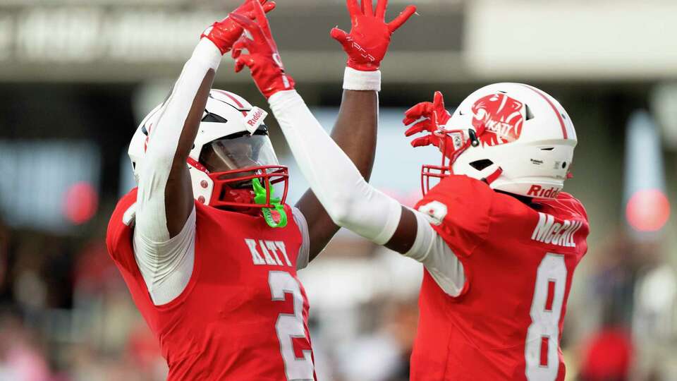 Katy running back Tremayne Hill (2) celebrates with wide receiver Cade McCall (8) after scoring a 32-yard touchdown during the first quarter of a non-district high school football game at Legacy Stadum, Friday, Sept. 6, 2024, in Katy.