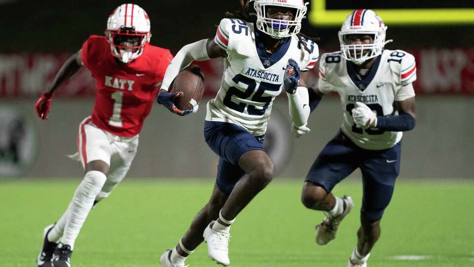 Atascocita defensive back Ta'von Bolden (25) returns the ball after intercepting a pass by Katy quarterback Gunner Nelson during the fourth quarter of a non-district high school football game at Legacy Stadum, Friday, Sept. 6, 2024, in Katy.