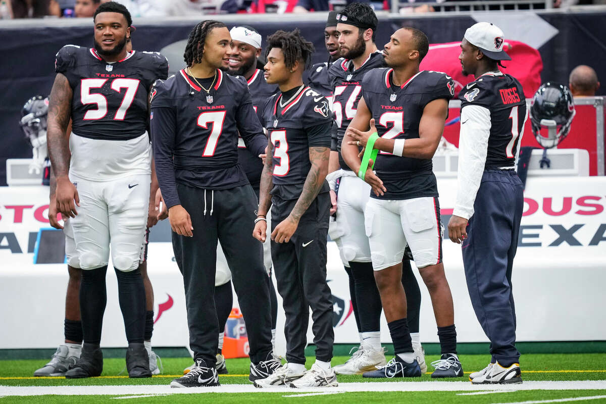 Houston Texans Blake Fisher (57), C.J. Stroud (7), Tank Dell (3), Jarrett Patterson (54), Robert Woods (2) and Stefon Diggs (1) stand together on the sidelines during the second half of an NFL preseason football game against the New York Giants Saturday, Aug. 17, 2024, in Houston.