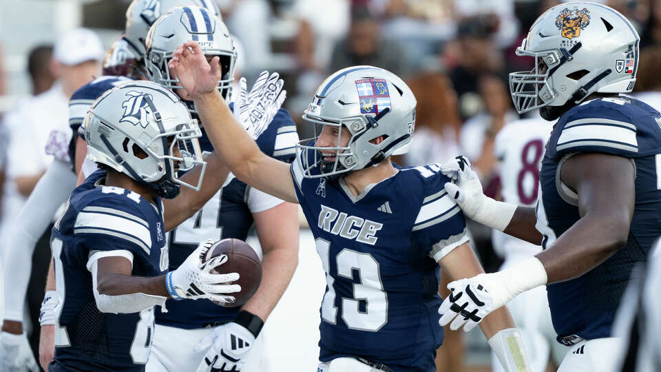 Rice wide receiver Braylen Walker, left, reacts after catching a 4-yard touchdown from quarterback E.J. Warner during the first half of a non-conference NCAA college football game at Rice Stadium, Saturday, Sept. 7, 2024, in Houston.