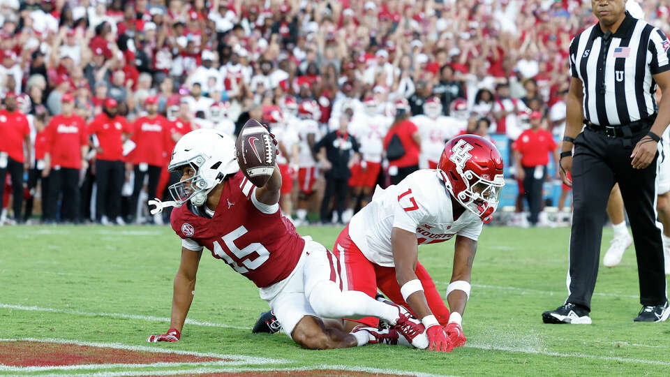 Oklahoma wide receiver Brenen Thompson (15) reacts after a touchdown on a play against Houston defensive back Kriston Davis (17) during the first quarter of an NCAA college football game Saturday, Sept. 7, 2024, in Norman, Okla. (AP Photo/Alonzo Adams)