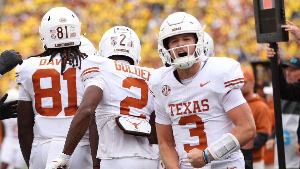 Texas quarterback Quinn Ewers celebrates after throwing a touchdown pass during the second quarter of the Longhorns' win Saturday over Michigan in Ann Arbor, Mich.