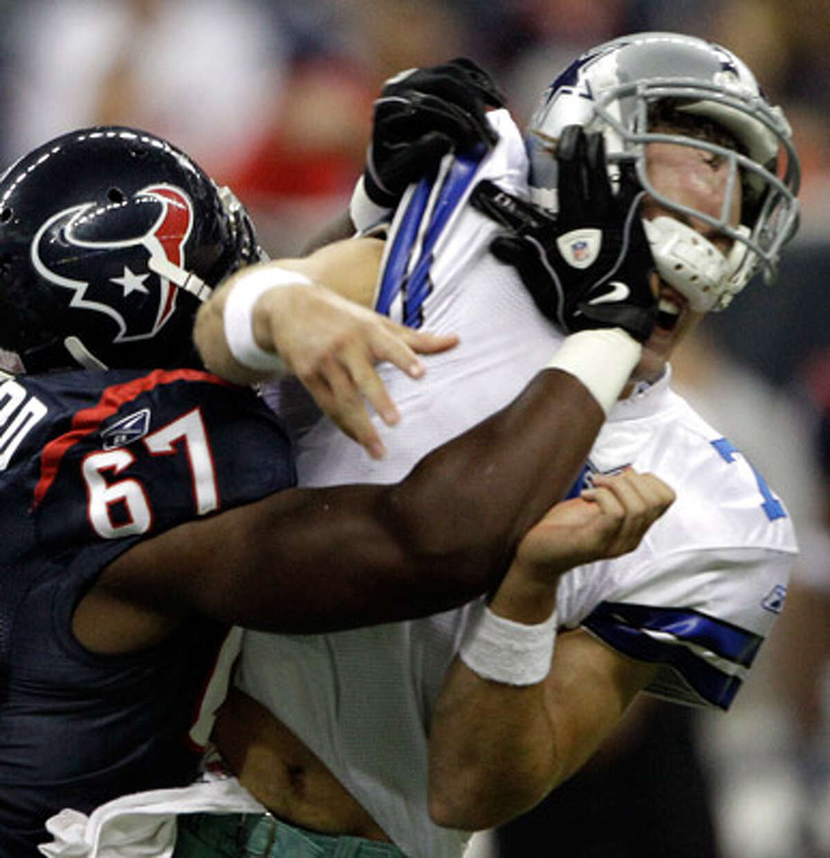 Cowboys third-string quarterback Stephen McGee gets rocked by Texans defensive tackle Malcolm Sheppard after throwing an incomplete pass Saturday. Houston won 23-7.