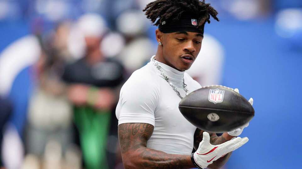 Houston Texans wide receiver Tank Dell warms up before an NFL football game against the Indianapolis Colts Sunday, Sept. 8, 2024, in Indianapolis.