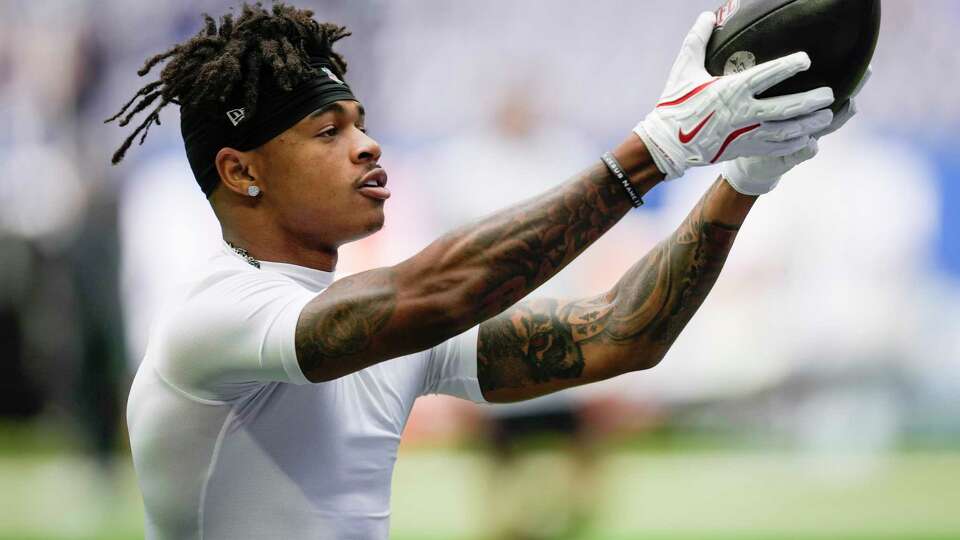 Houston Texans wide receiver Tank Dell warms up before an NFL football game against the Indianapolis Colts Sunday, Sept. 8, 2024, in Indianapolis.