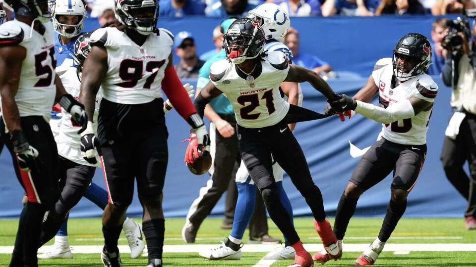 Houston Texans safety Calen Bullock (21) is seen after intercepting a pass intended for Indianapolis Colts tight end Kylen Granson after he slipped on the turf during the first half of an NFL football game at Lucas Oil Stadium, Sunday, Sept. 8, 2024, in Indianapolis.