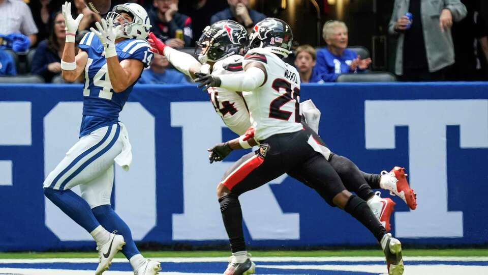 Indianapolis Colts wide receiver Alec Pierce (14) beats Houston Texans cornerback Derek Stingley Jr. (24) and Houston Texans safety Jimmie Ward (20) for a 60-yard touchdown reception during the first half of an NFL football game Sunday, Sept. 8, 2024, in Indianapolis.