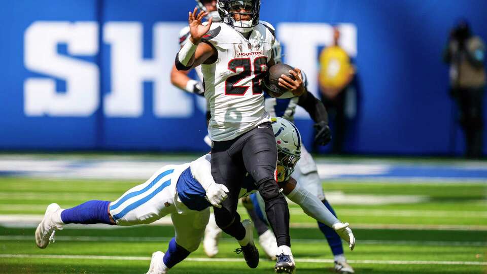 Houston Texans running back Joe Mixon (28) runs the ball against the Indianapolis Colts during the second half of an NFL football game Sunday, Sept. 8, 2024, in Indianapolis.