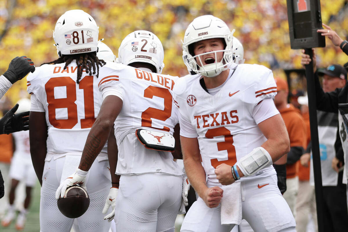 Quinn Ewers #3 of the Texas Longhorns celebrates after throwing a touchdown pass during the second quarter against the Michigan Wolverines at Michigan Stadium on September 07, 2024 in Ann Arbor, Michigan. 