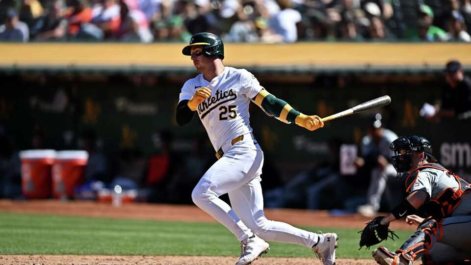 OAKLAND, CALIFORNIA - SEPTEMBER 07: Brent Rooker #25 of the Oakland Athletics hits a single against the Detroit Tigers in the eighth inning at the Oakland Coliseum on September 7, 2024 in Oakland, California.