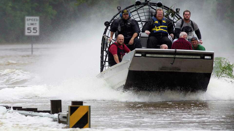 Residents are evacuated from their homes by airboat across the San Jacinto River on FM 1485, Tuesday, Aug. 29, 2017, in New Caney. Members of the Cajun Navy, a volunteer civilian group that helps those affected by disasters, helped with rescue and recovery efforts in East Montgomery County.