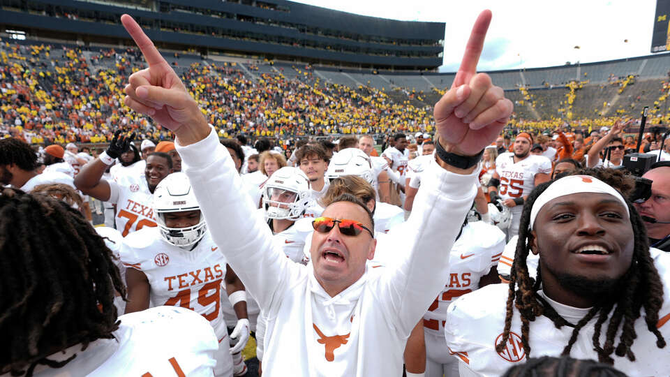 Texas coach Steve Sarkisian, celebrating the team's win at Michigan, is quick to remind his team they aren't guaranteed anything after the victory.