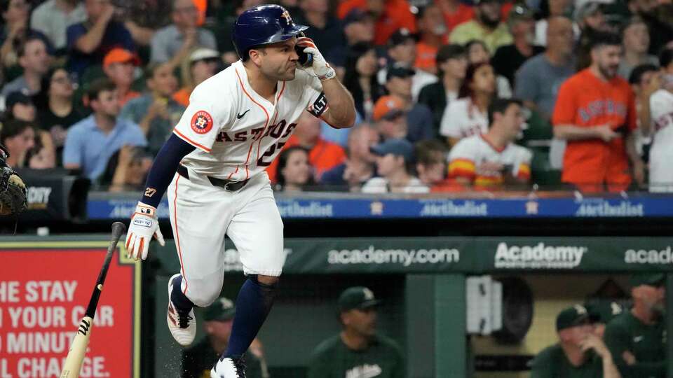 Houston Astros Jose Altuve (27) hits an RBI single to tie up the game against the Oakland Athletics during the seventh inning of an MLB game at Minute Maid Park on Tuesday, Sept. 10, 2024, in Houston.