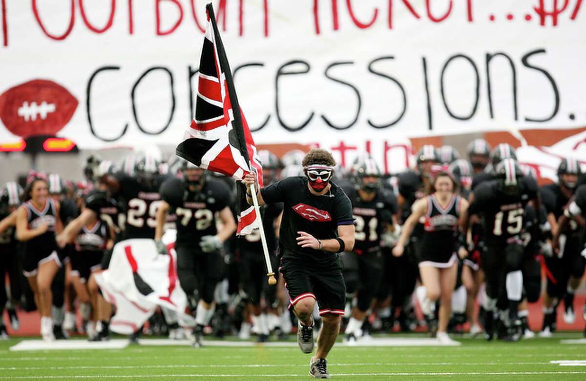 Churchill Superfan Eric Moritz leads the team onto the field against Clark prior to the start of the Gucci Bowl Thursday Aug. 26, 2010 at Heroes Stadium. Churchill went on to win 21-7.
