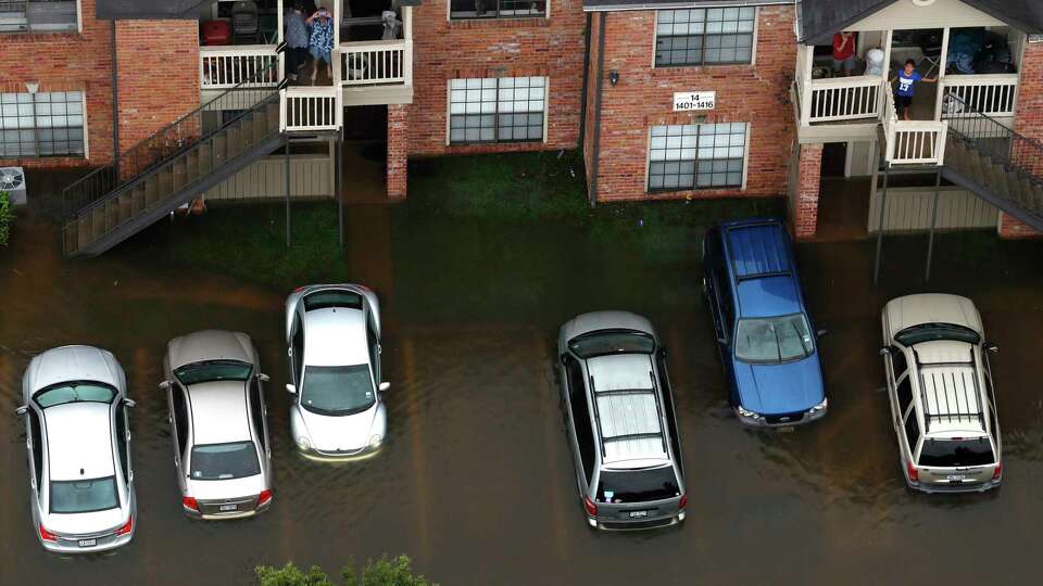 Floodwaters from Tropical Storm Harvey surround an apartment complex on Tuesday, Aug. 29, 2017, in Houston.