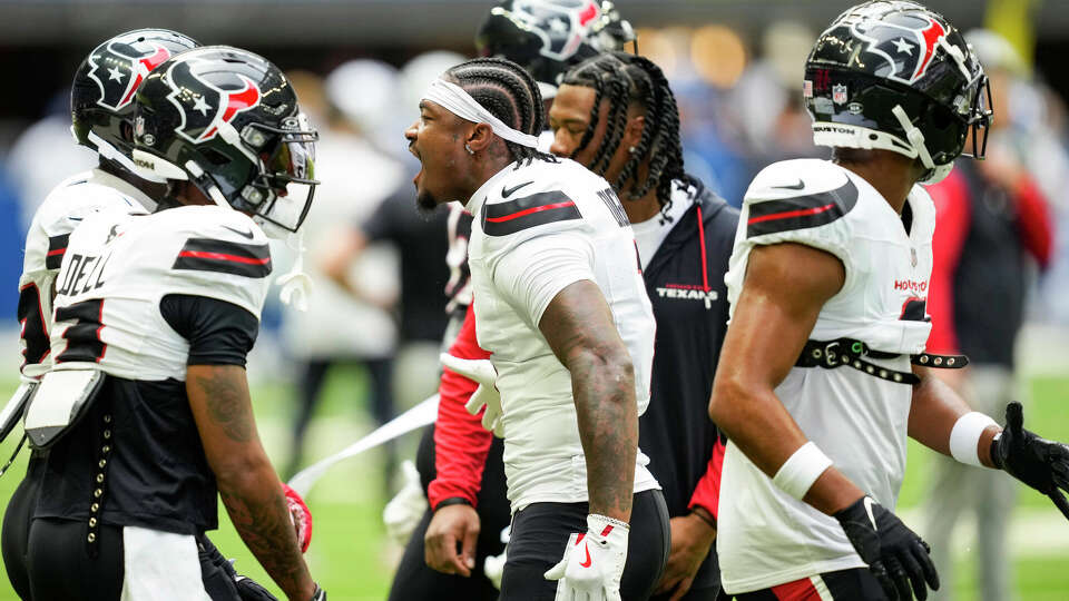 Houston Texans wide receiver Stefon Diggs, center, yells as he breaks the wide receivers huddle before an NFL football game against the Indianapolis Colts Sunday, Sept. 8, 2024, in Indianapolis.