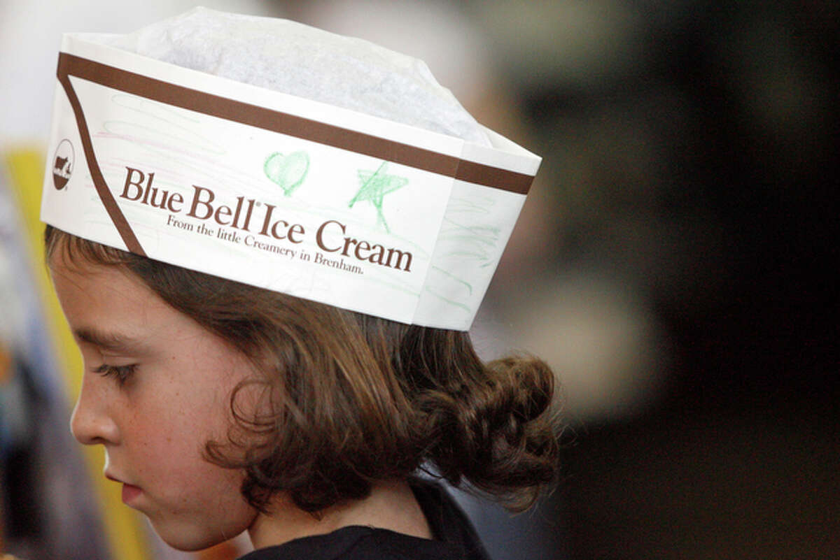 Carly Wulfsberg, 9, wears a free hat provided by Blue Bell.
