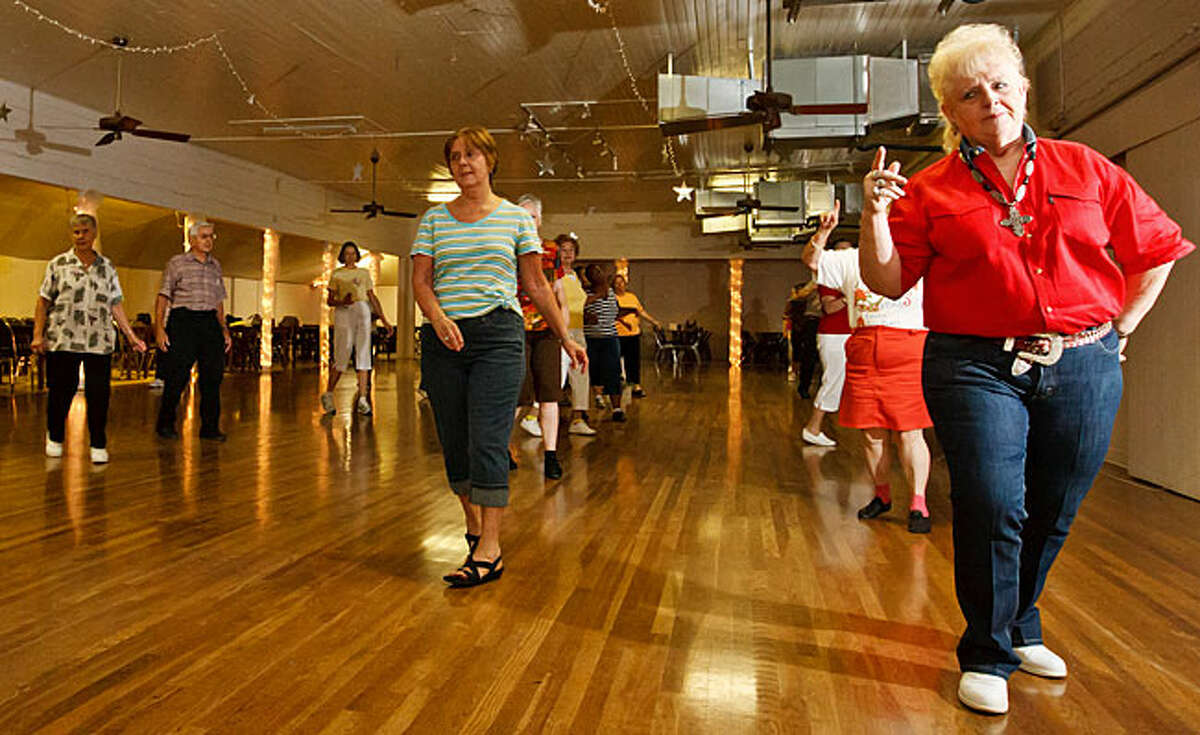 Line dancers strutt their stuff during a class at Braun Hall, 9723 Braun Road. Line dancing classes are held there Tuesday evenings and Friday mornings, and baseball and other activities keep folks coming.