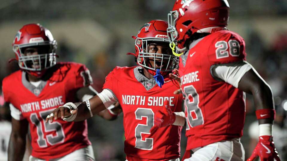 North Shore running back Chris Thomas, center, celebrates D’Andre Hardeman’s touchdown during the second quarter of a non-district high school football game at Galena ISD Stadium, Friday, Sept. 13, 2024, in Houston.