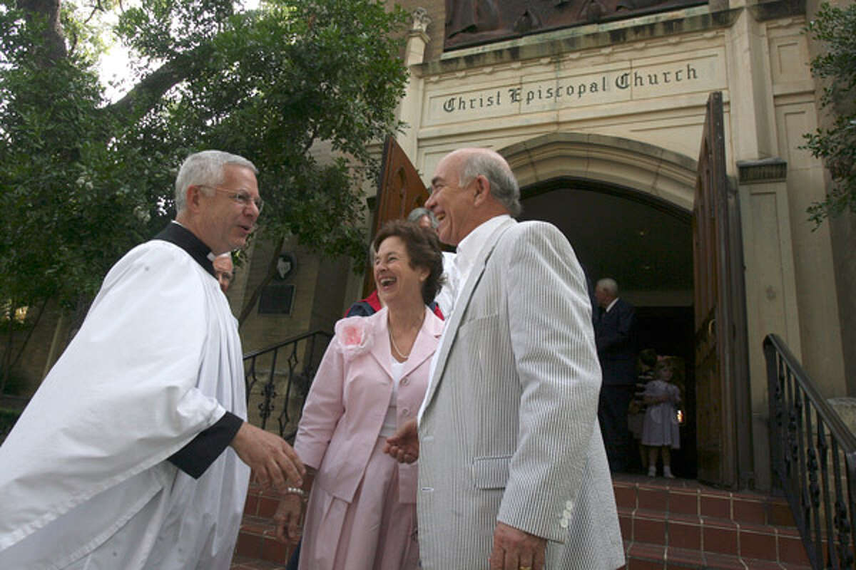 The Rev. Chuck Collins greets Susan and Bill Galbreath after Collins? last service at Christ Episcopal Church in late May. He retired over concerns about the national Episcopal Church?s liberal changes, including approval of gay and lesbian clergy.