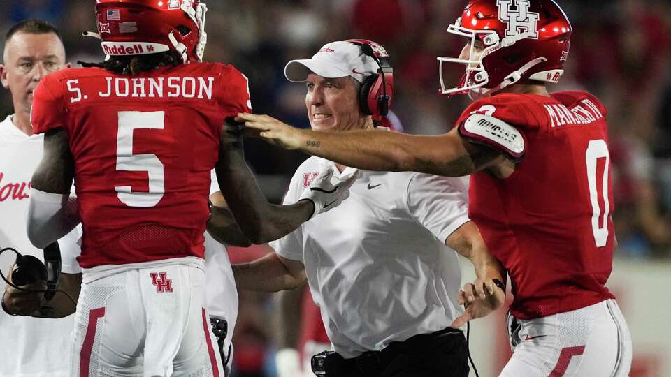 Houston Cougars head coach Willie Fritz reacts toward wide receiver Stephon Johnson (5) after he got in a scuffle with a Rice player during the second quarter of a non-conference college football game at TDECU Stadium, Saturday, Sept. 14, 2024, in Houston.