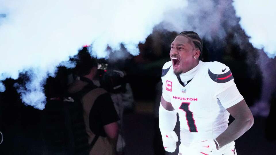 Houston Texans wide receiver Stefon Diggs (1) runs out of the tunnel before an NFL football game at NRG Stadium, Sunday, Sept. 15, 2024, in Houston.