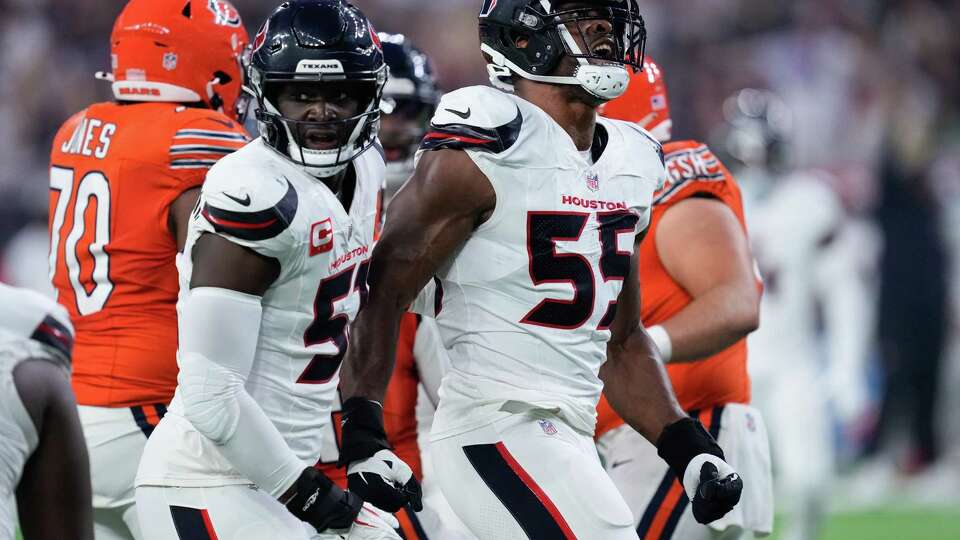 Houston Texans defensive end Danielle Hunter (55) reacts alongside defensive end Will Anderson Jr. (51) after the two tackled Chicago Bears running back D'Andre Swift during the first quarter of an NFL football game at NRG Stadium, Sunday, Sept. 15, 2024, in Houston.