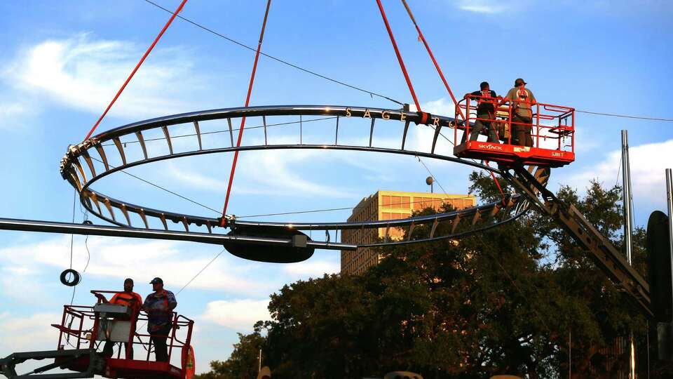 Work Crews install the last of Uptown HoustonÕs iconic six stainless-steel rings at the intersection of Sage and Westheimer road on Sunday, Sept. 15, 2024, in Houston. The reimagined rings measure 40 feet in diameter, are 6,000 pounds and feature an efficient LED technology, replacing the old neon lights. This new lighting system allows colors to be changed to celebrate big city moments. The reimagined rings measure 40 feet in diameter, are 6,000 pounds and feature an efficient LED technology, replacing the old neon lights. This new lighting system allows colors to be changed to celebrate big city moments.