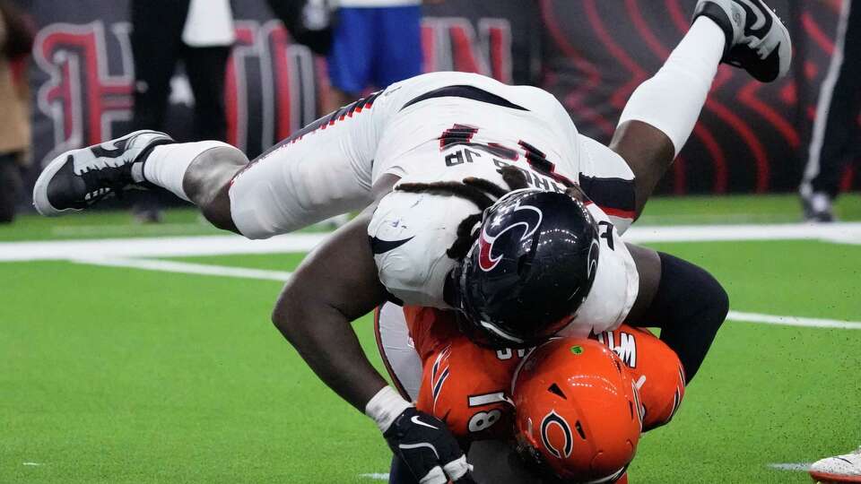 Houston Texans defensive end Mario Edwards Jr. (97) sacks Chicago Bears quarterback Caleb Williams (18) during the fourth quarter of an NFL football game at NRG Stadium, Sunday, Sept. 15, 2024, in Houston.