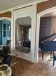Erika Gallagher with Plum & Crimson Fine Interior Design in Saratoga Springs creates a decorative accent with wall mirrors to add dimension and light to a room.