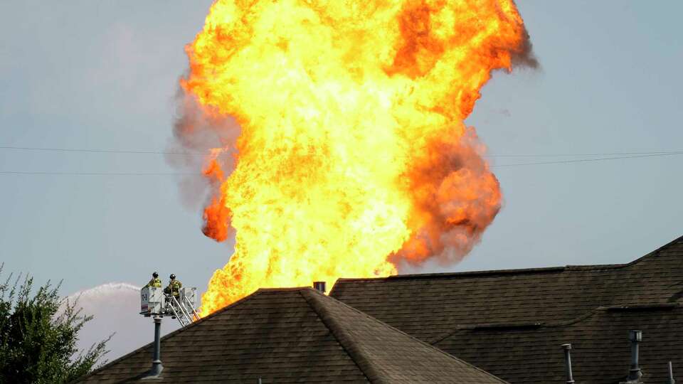 Firefighters spraying water to keep the pipeline fire under control Monday, Sept. 16, 2024 in Deer Park.