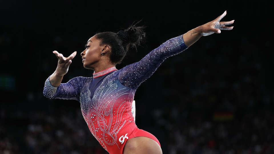 Simone Biles, performing her floor routine in Paris, is on tour with the Gold over America Tour. It will be in Houston on Oct. 19.