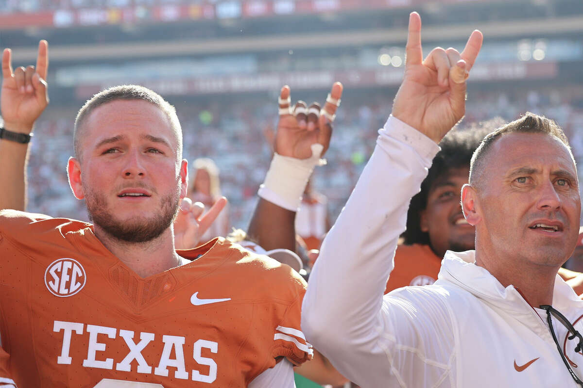 Texas quarterback Quinn Ewers (3) and head coach Steve Sarkisian celebrate a win against Colorado State during an NCAA football game on Saturday, Aug. 31, 2024 in Austin, Texas. 