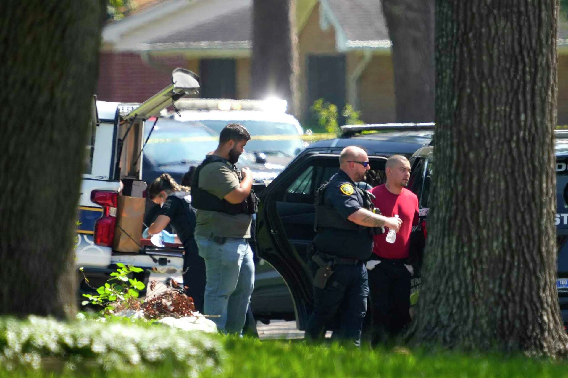 3 charged over Houston robbery that left police officer wounded