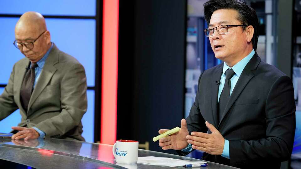 VIETV Network News Anchors Charlie Thai, right, and Co Pham are photographed during a daily news show recording Tuesday, Sept. 17, 2024 in Houston.