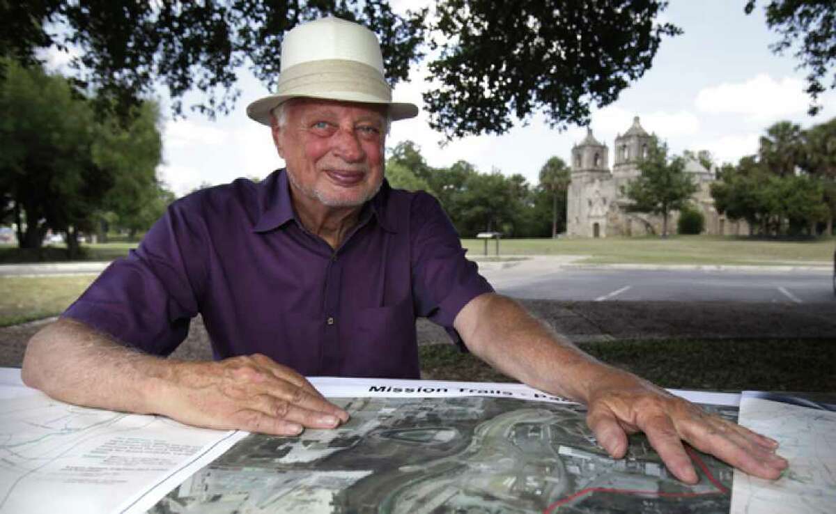 Milton Guess, seated in front of Mission Concepcion, said the project to link the Spanish colonial missions is a matter of economic development.