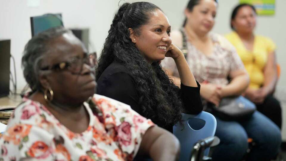 People attend a legal clinic at the Youth Development Center, 6050 Bretshire Dr., Wednesday, Sept. 18, 2024, in Houston. The Houston ISD's Sunrise Center, a service hub designed to provide HISD students and their families with a variety of resources, is located in the center.