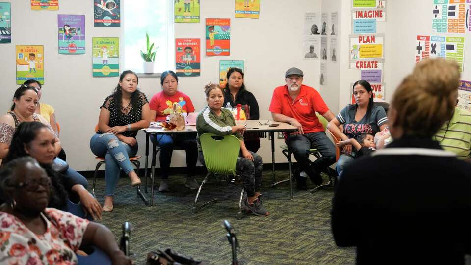 People attend a legal clinic at the Youth Development Center, 6050 Bretshire Dr., Wednesday, Sept. 18, 2024, in Houston. The Houston ISD's Sunrise Center, a service hub designed to provide HISD students and their families with a variety of resources, is located in the center.