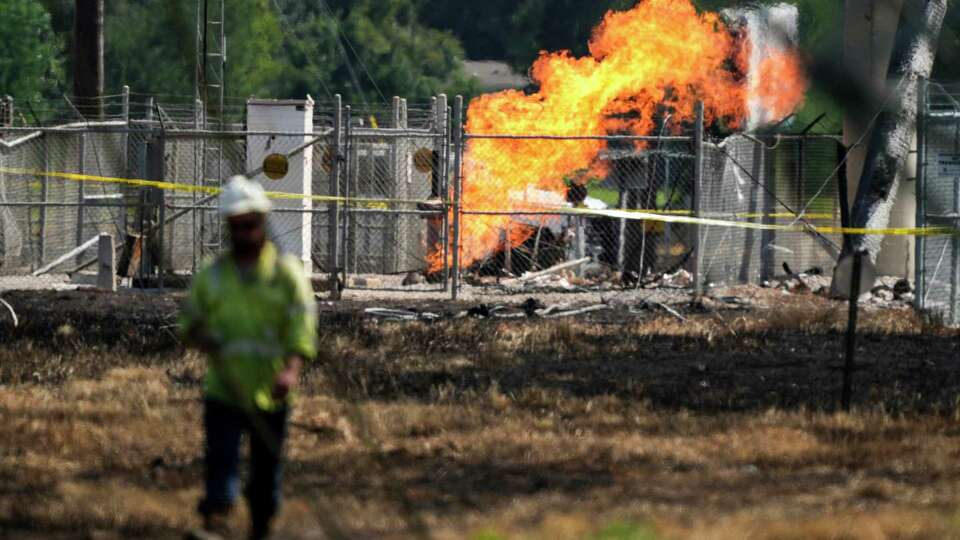 An above-ground valve continues to burn three days after after a vehicle drove through a fence along a parking lot and struck the site, Wednesday, Sept. 18, 2024, in La Porte.