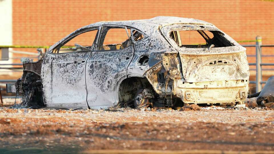 A fire damaged vehicle after three days ago it struck an above-ground valve causing a large pipeline fire, Wednesday, Sept. 18, 2024, in Deer Park.