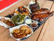 Fried green tomatoes, sausage, collard greens, rib tips, jerk chicken, turkey legs at Southern Q BBQ