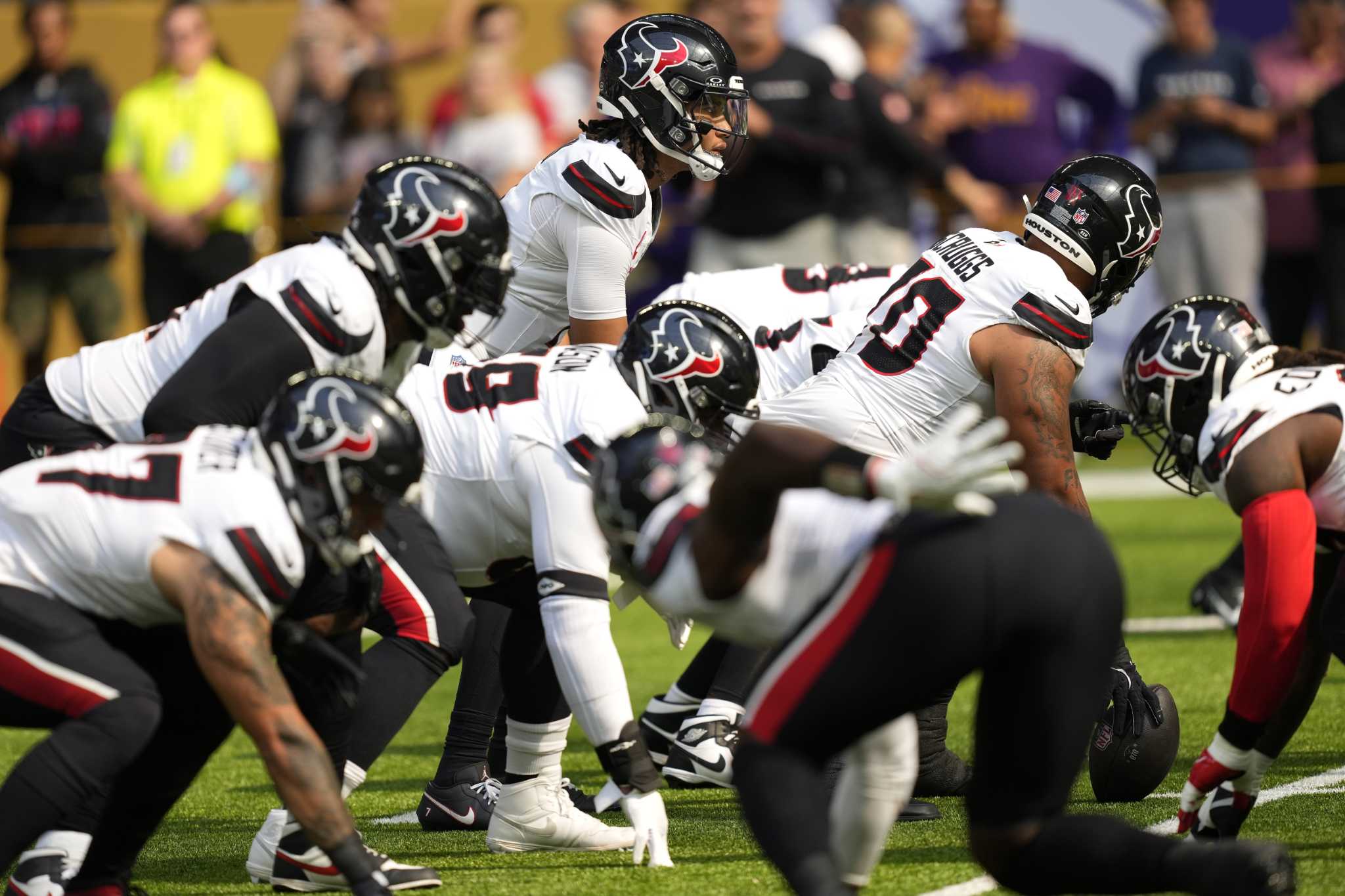 Referee Shawn Hochuli shakes head at Texans' false start penalties